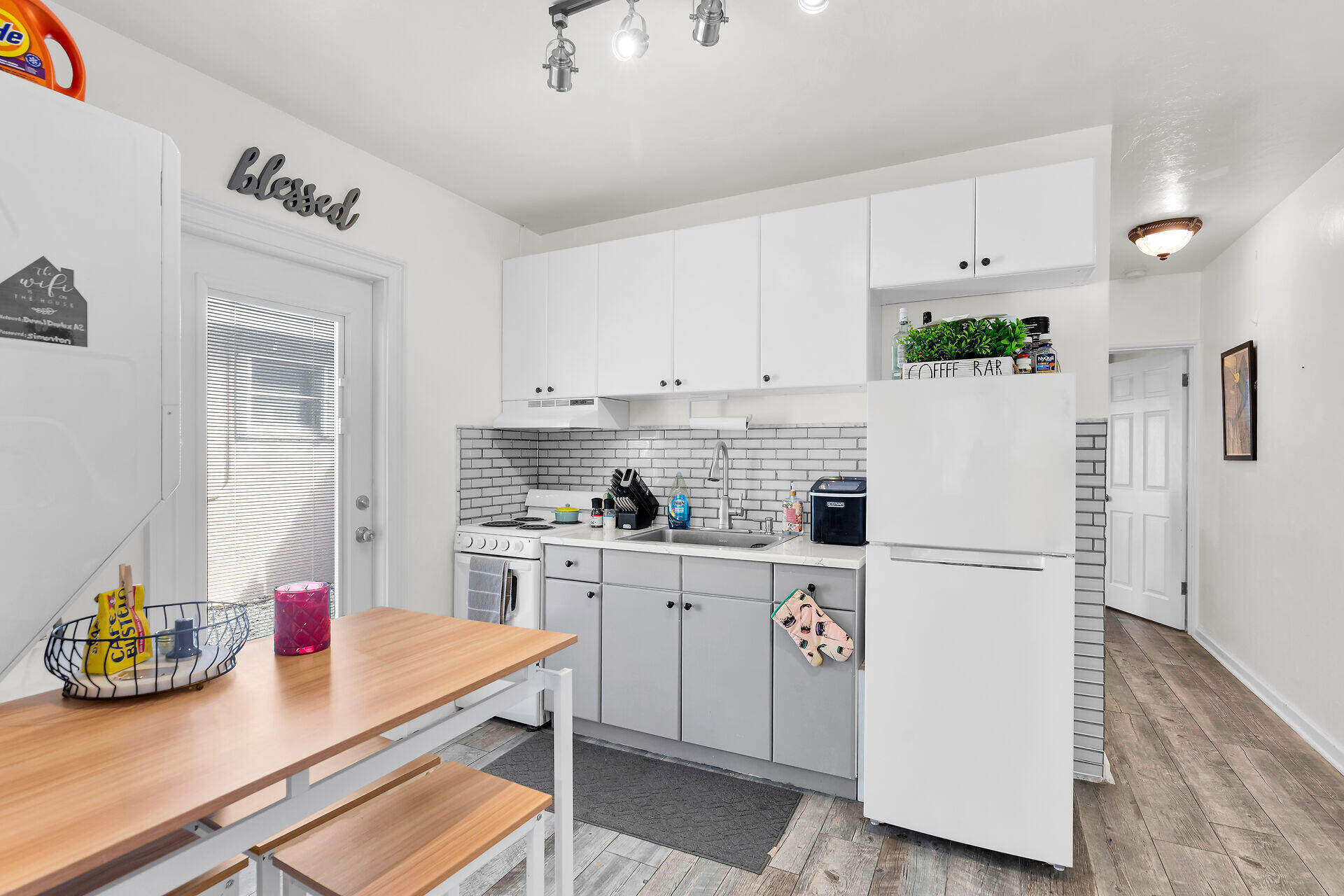1119 Simonton Street, Unit A2 & C1 Key West, FL 33040 - Photo 8 of 20 a kitchen with stainless steel appliances a stove refrigerator sink and cabinets