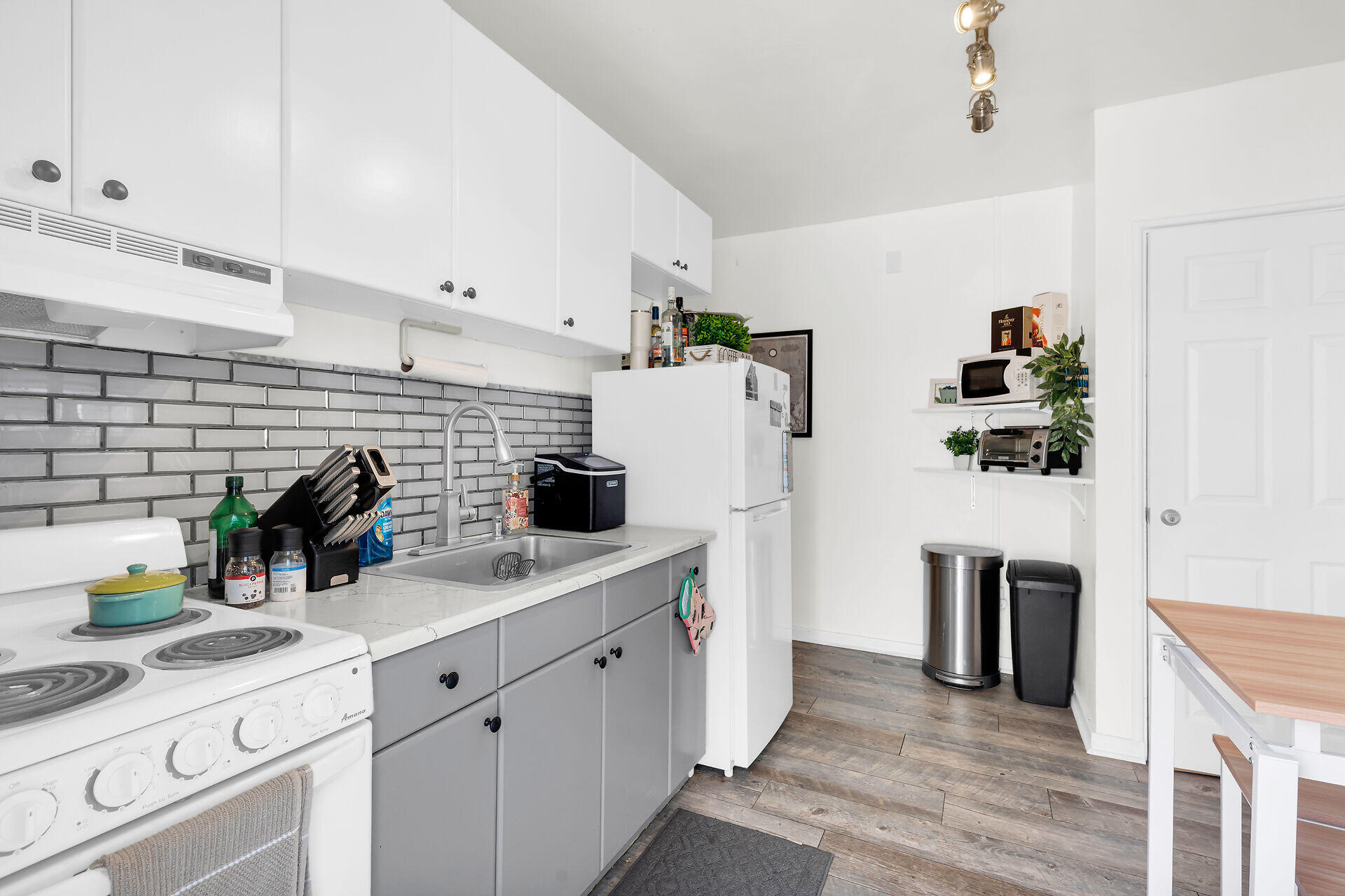 1119 Simonton Street, Unit A2 & C1 Key West, FL 33040 - Photo 10 of 20 a kitchen with stainless steel appliances a sink a stove and refrigerator