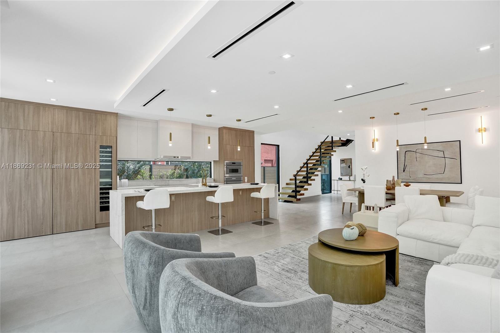 1825 Northeast 26th Avenue, Unit C Fort Lauderdale, FL 33305 - Photo 18 of 90 a living room with fireplace furniture and a wooden floor