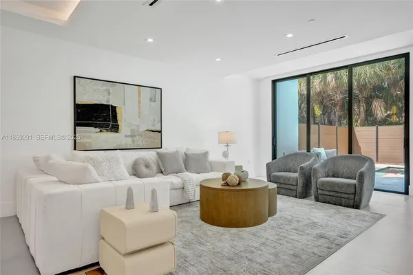 a living room with furniture and a table