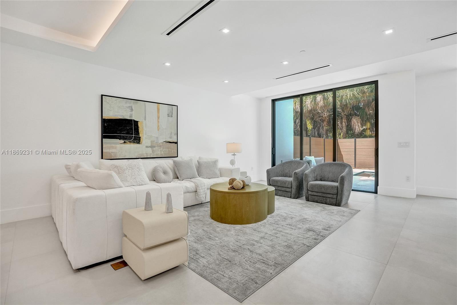 1825 Northeast 26th Avenue, Unit C Fort Lauderdale, FL 33305 - Photo 22 of 90 a living room with furniture and a large window