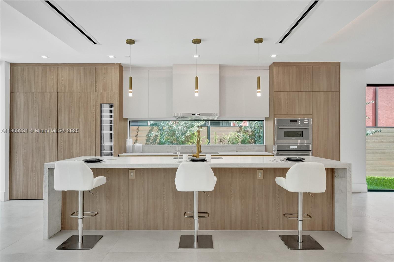 1825 Northeast 26th Avenue, Unit C Fort Lauderdale, FL 33305 - Photo 29 of 90 a kitchen with a sink cabinets and window