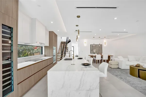 a bathroom with a sink a mirror a shower and vanity