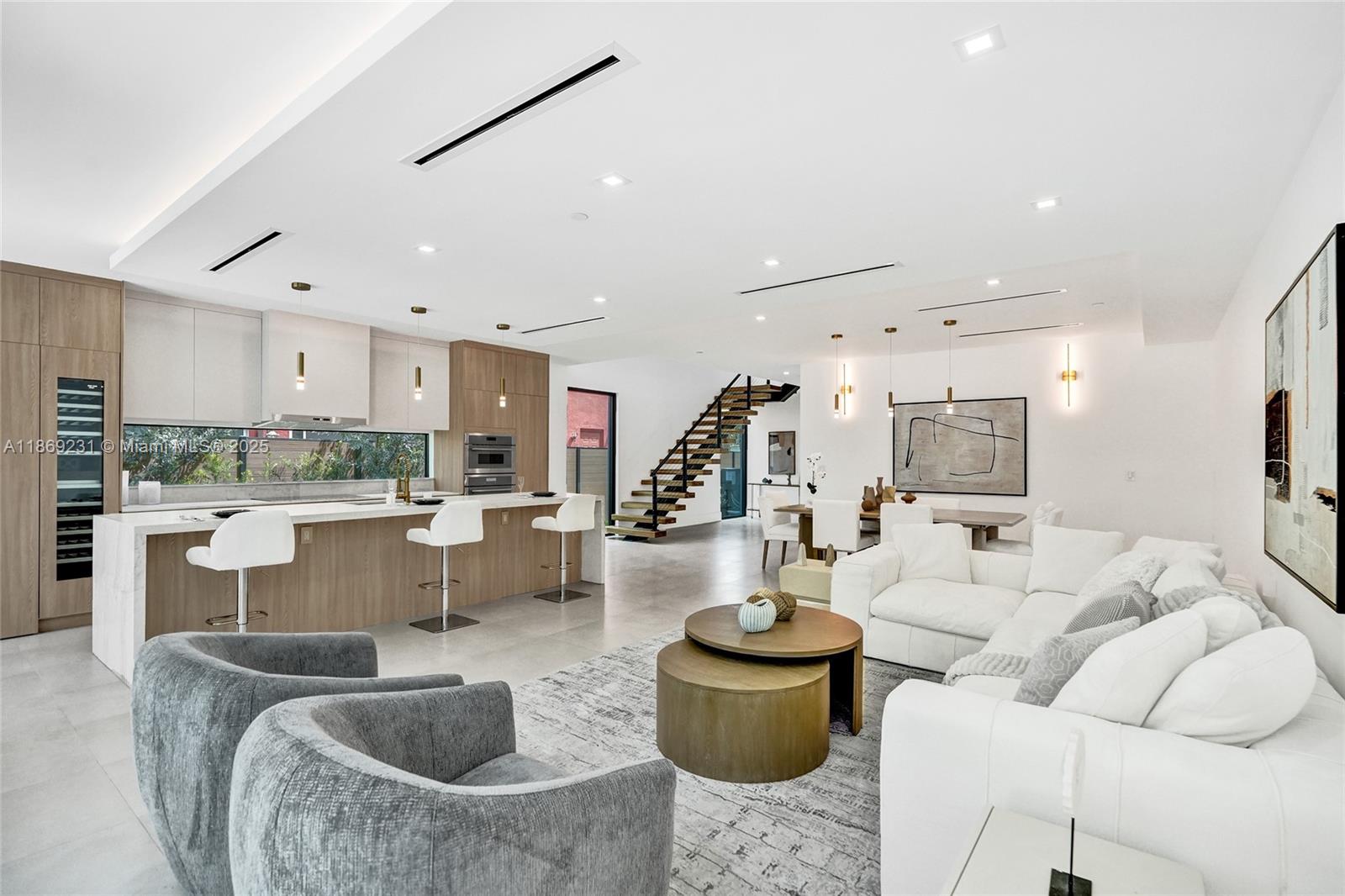 1825 Northeast 26th Avenue, Unit C Fort Lauderdale, FL 33305 - Photo 36 of 90 a living room with furniture and a large window