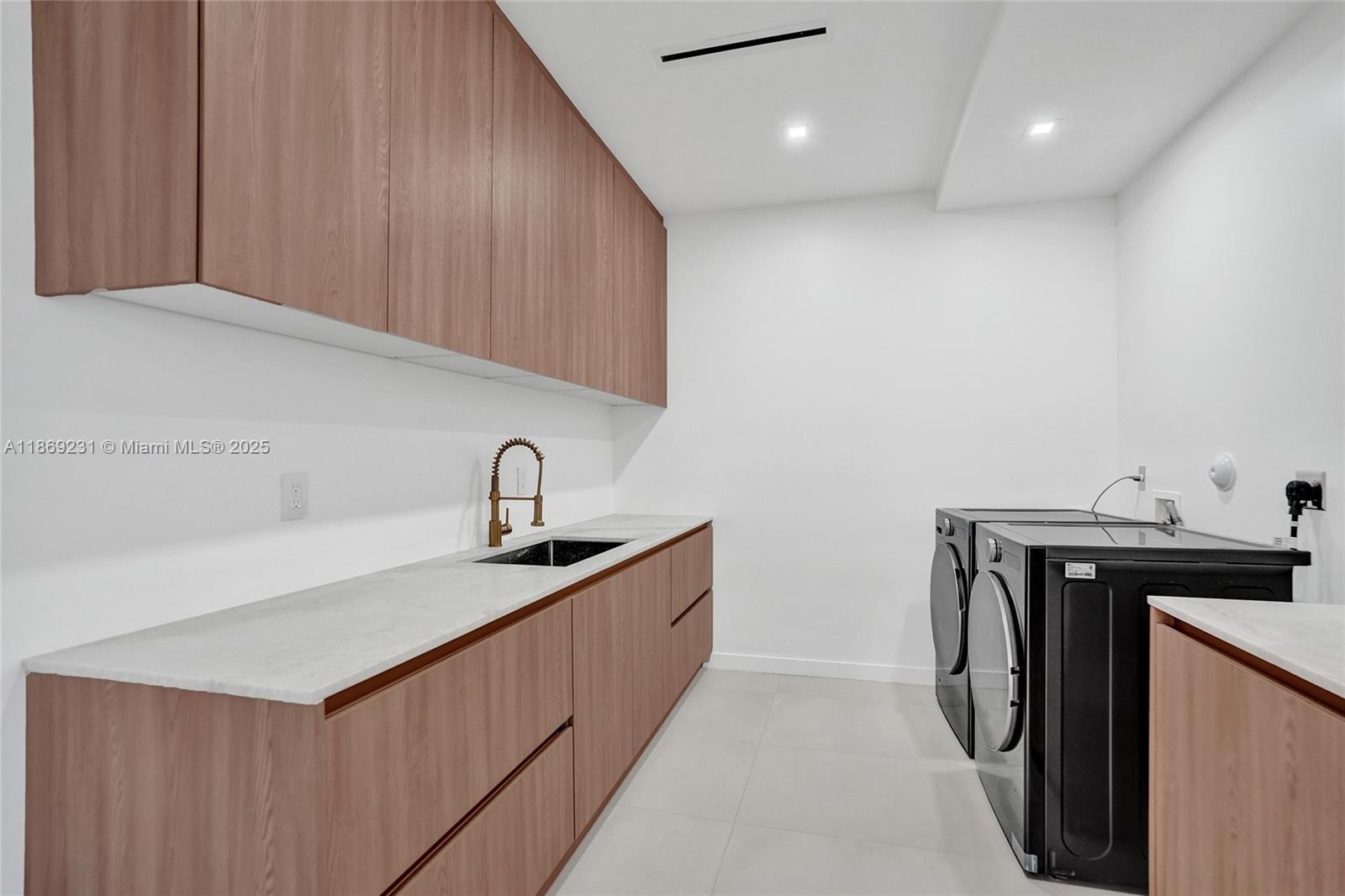1825 Northeast 26th Avenue, Unit C Fort Lauderdale, FL 33305 - Photo 39 of 90 a utility room with sink dryer and washer