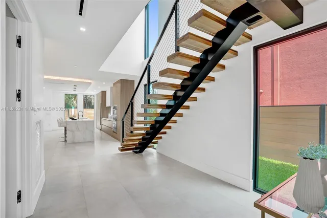 a view of a kitchen with a stove top oven