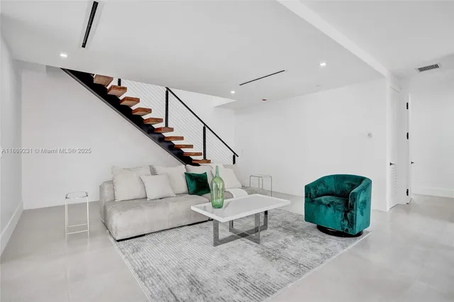 a outdoor space with patio couches and a fireplace