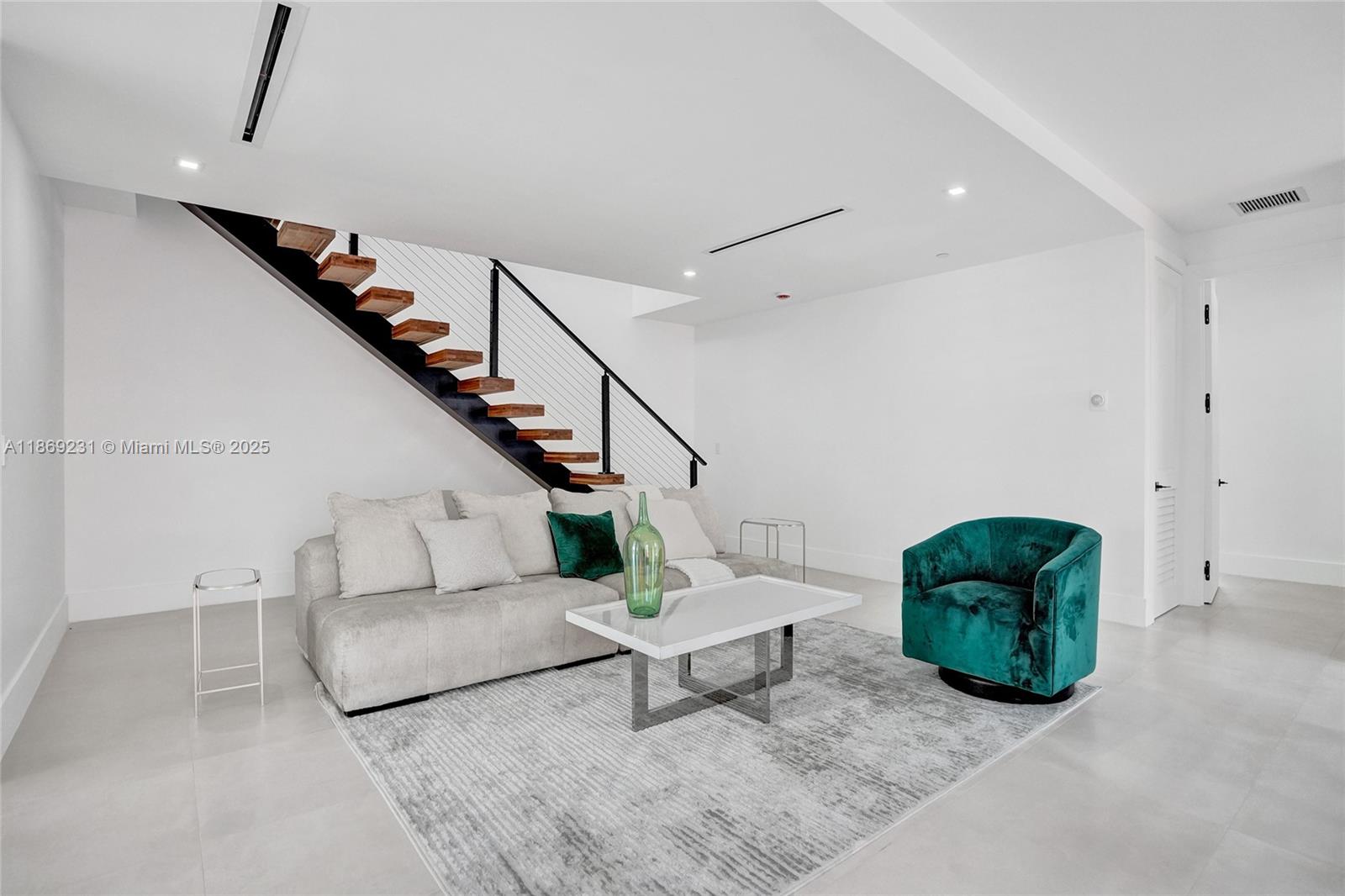 1825 Northeast 26th Avenue, Unit C Fort Lauderdale, FL 33305 - Photo 43 of 90 a living room with furniture and stairs