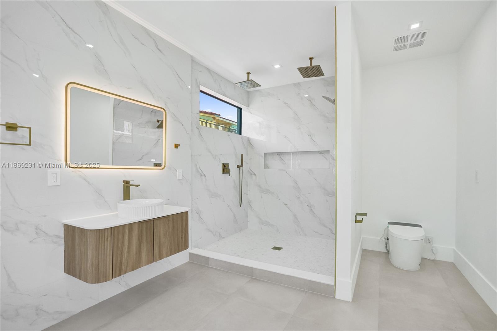 1825 Northeast 26th Avenue, Unit C Fort Lauderdale, FL 33305 - Photo 57 of 90 a bathroom with a sink a toilet and shower