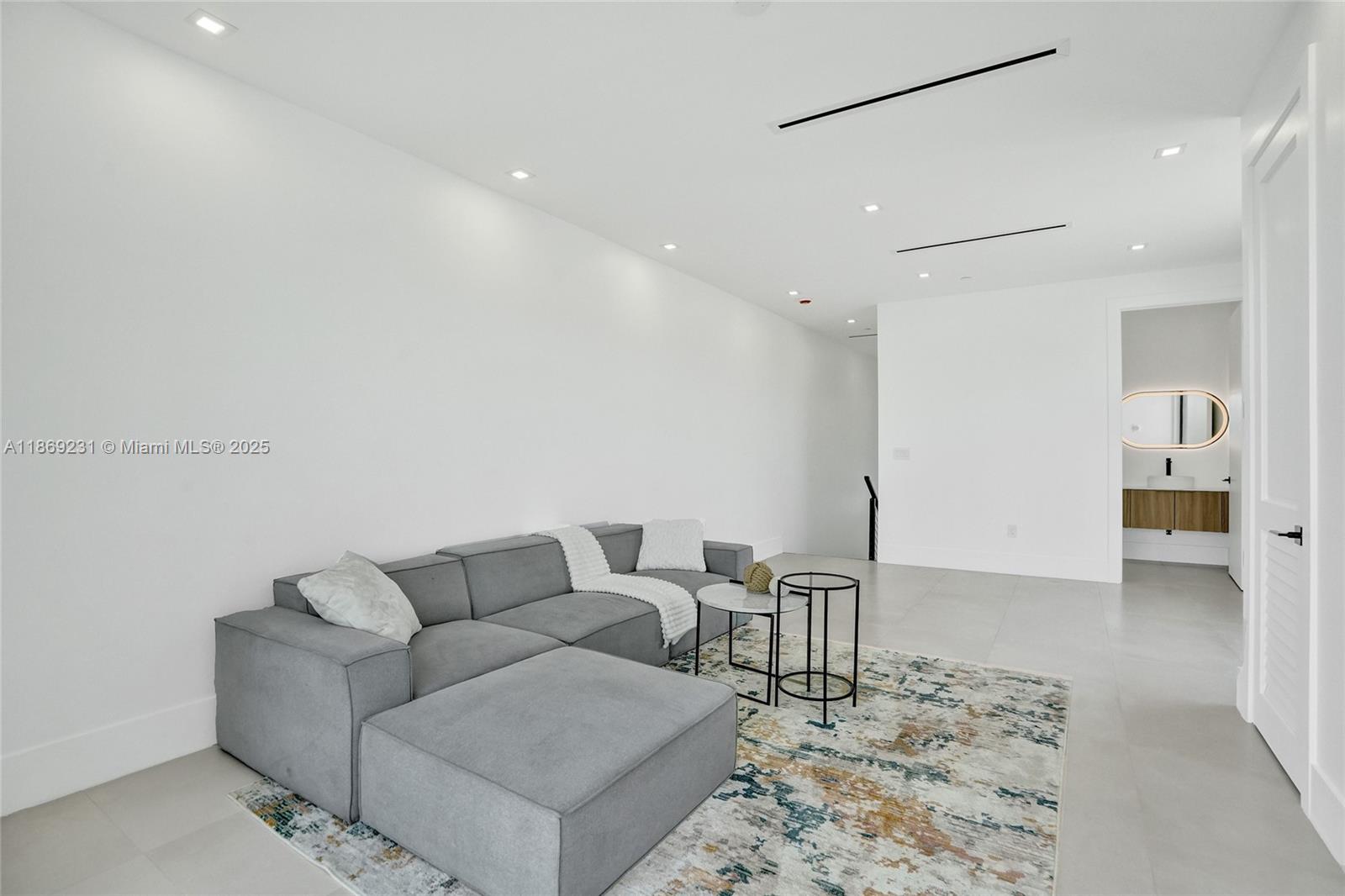 1825 Northeast 26th Avenue, Unit C Fort Lauderdale, FL 33305 - Photo 60 of 90 a living room with furniture and kitchen view