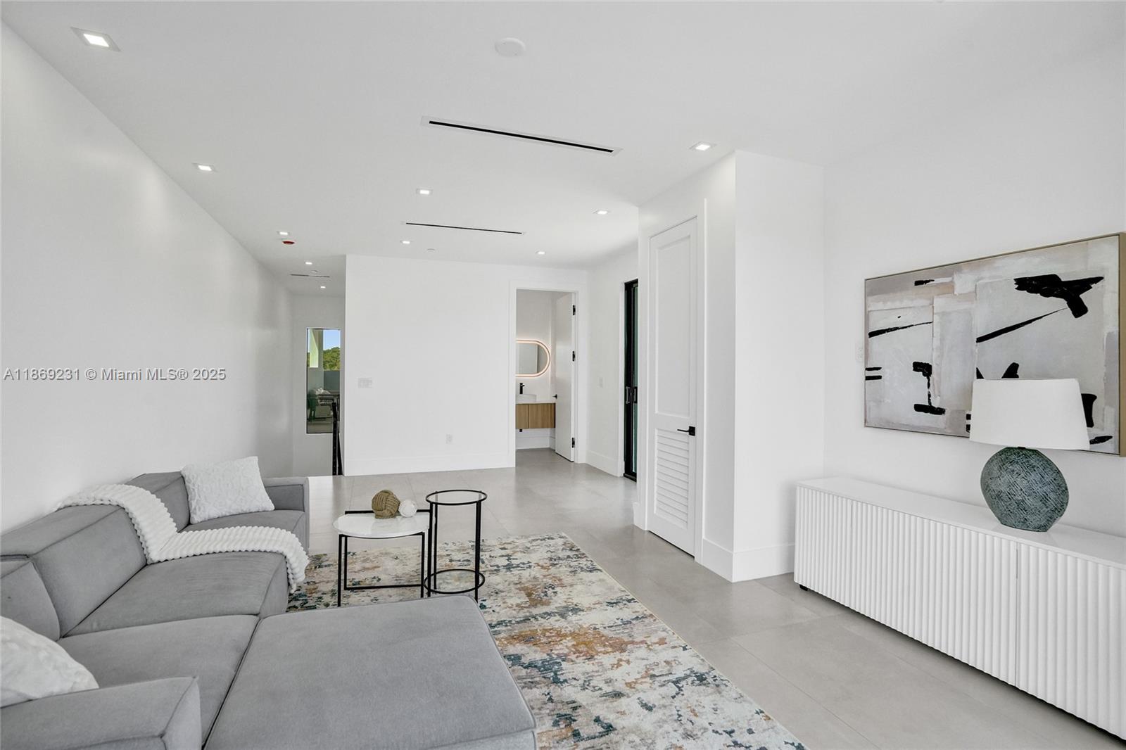 1825 Northeast 26th Avenue, Unit C Fort Lauderdale, FL 33305 - Photo 61 of 90 a living room with furniture and wooden floor