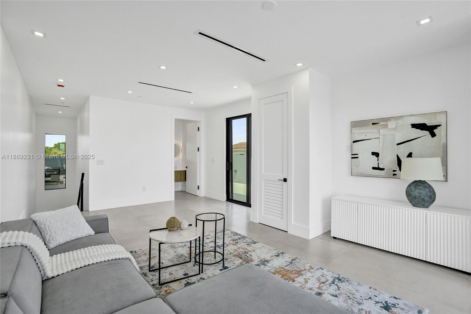 1825 Northeast 26th Avenue, Unit C Fort Lauderdale, FL 33305 - Photo 62 of 90 a living room with furniture and wooden floor