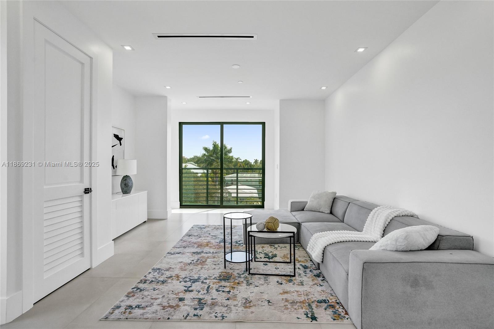 1825 Northeast 26th Avenue, Unit C Fort Lauderdale, FL 33305 - Photo 63 of 90 a living room with furniture and a window