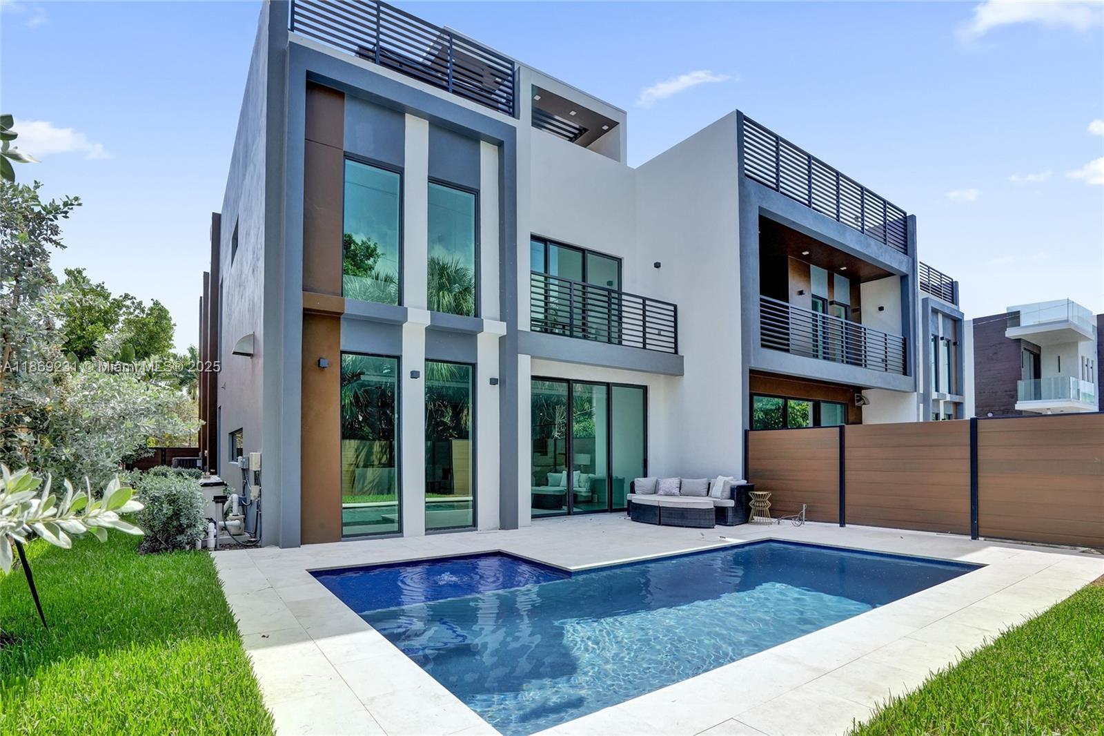 1825 Northeast 26th Avenue, Unit C Fort Lauderdale, FL 33305 - Photo 81 of 90 a view of a building with a swimming pool