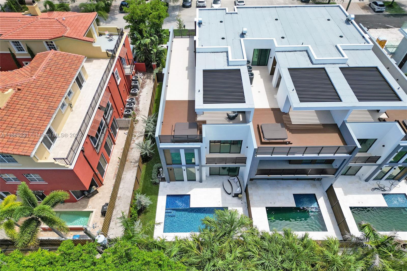 1825 Northeast 26th Avenue, Unit C Fort Lauderdale, FL 33305 - Photo 88 of 90 an aerial view of residential houses with outdoor space