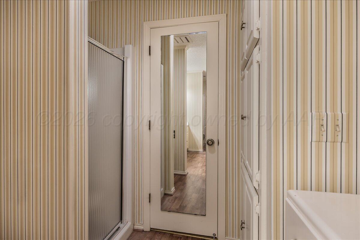1615 South Bryan Street, Unit 1 Amarillo, TX 79102 - Photo 20 of 30 a bathroom with a glass shower door and a sink