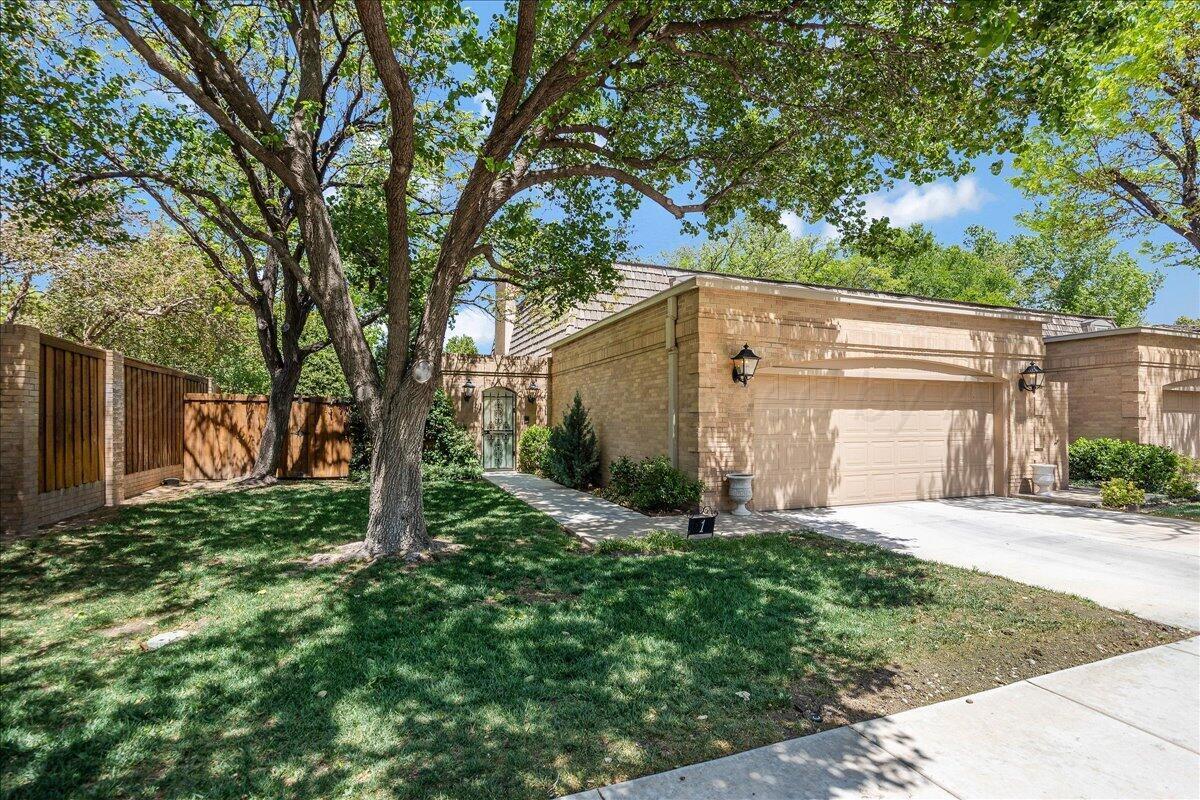 1615 South Bryan Street, Unit 1 Amarillo, TX 79102 - Photo 2 of 30 a view of a house with a back yard