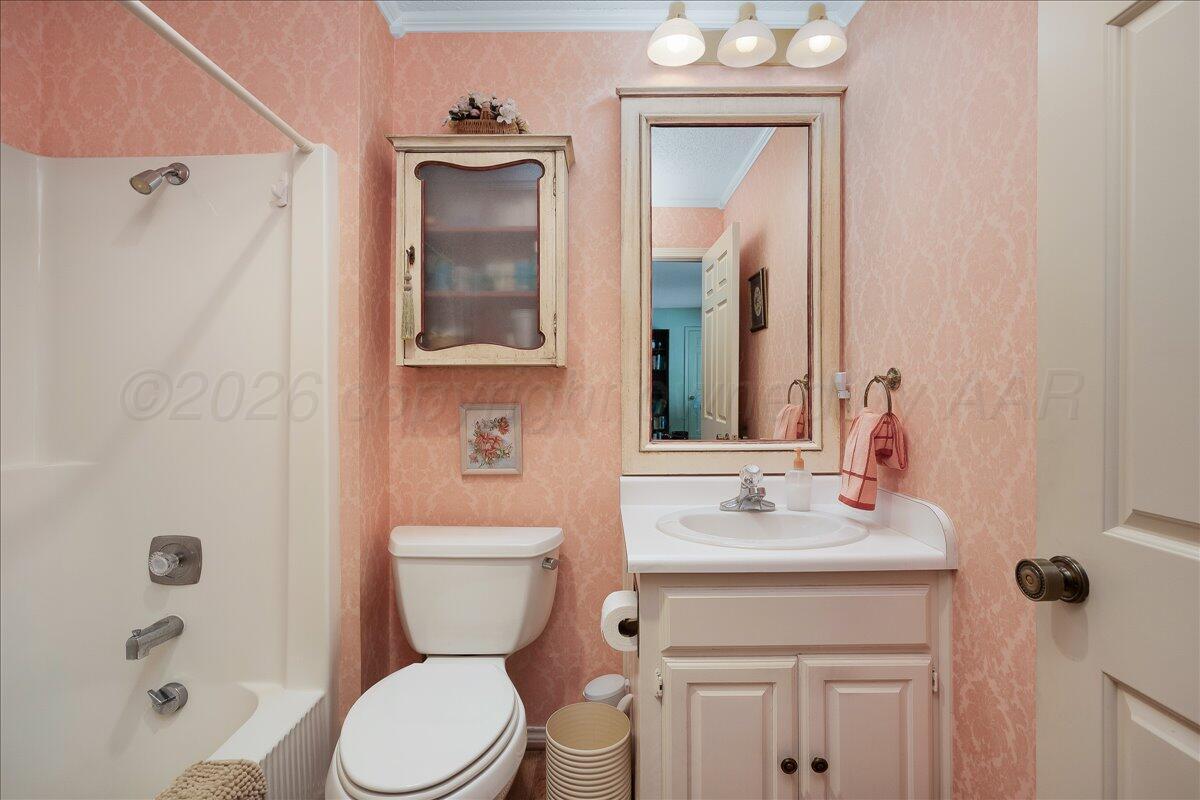 1615 South Bryan Street, Unit 1 Amarillo, TX 79102 - Photo 23 of 30 a bathroom with a sink vanity mirror and toilet
