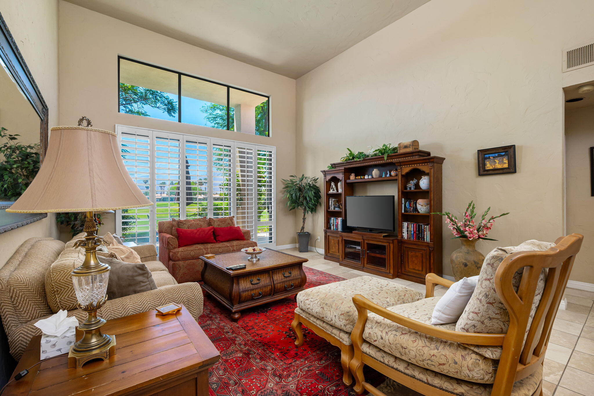 80601 Oak-Tree La Quinta, CA 92253 - Photo 17 of 64 a living room with furniture fireplace and flat screen tv