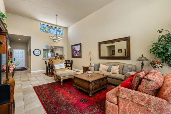 a kitchen with stainless steel appliances granite countertop a refrigerator sink and stove
