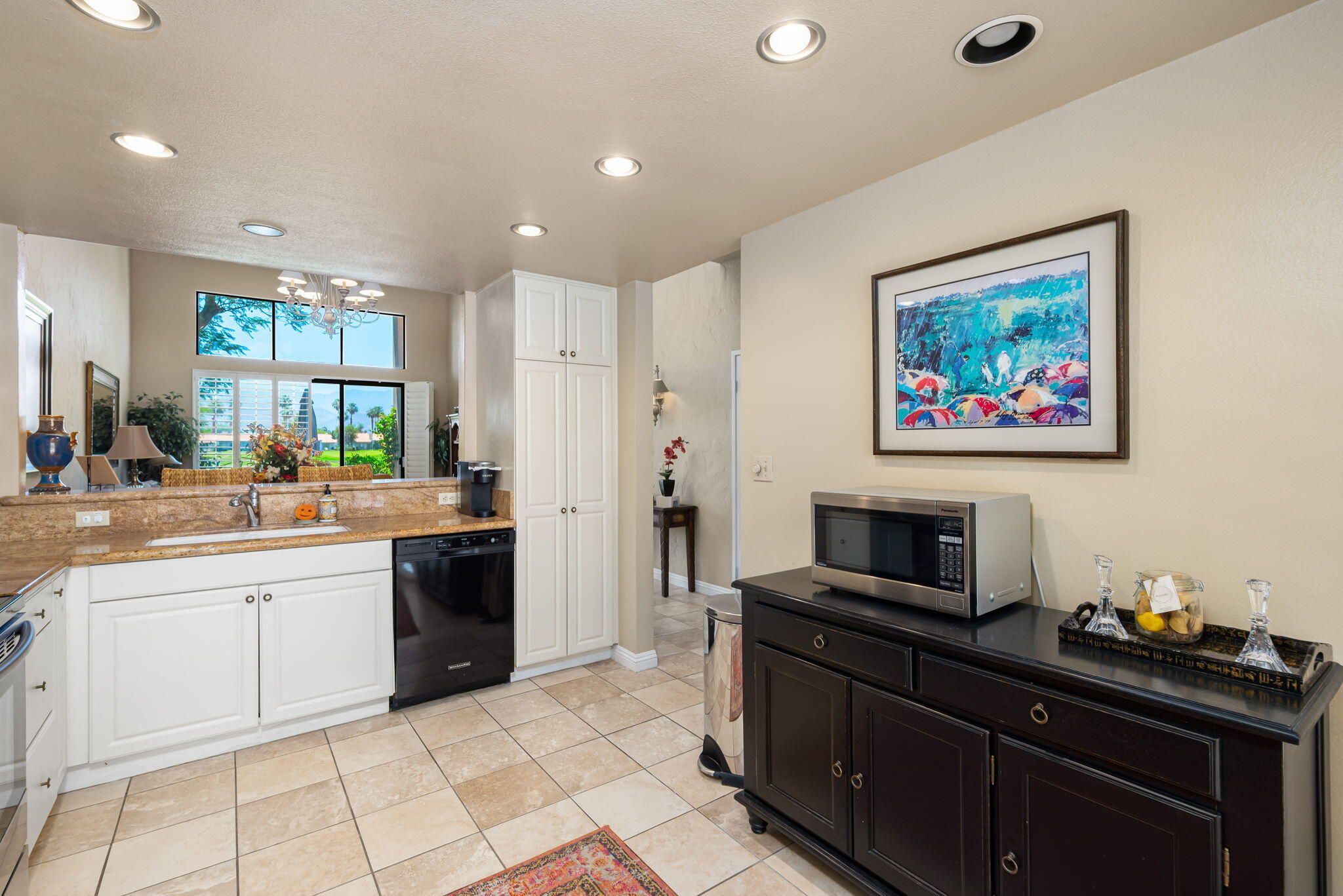 80601 Oak-Tree La Quinta, CA 92253 - Photo 23 of 64 a kitchen with a refrigerator and a sink