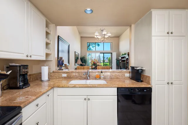 a bedroom with a bed and a flat tv screen