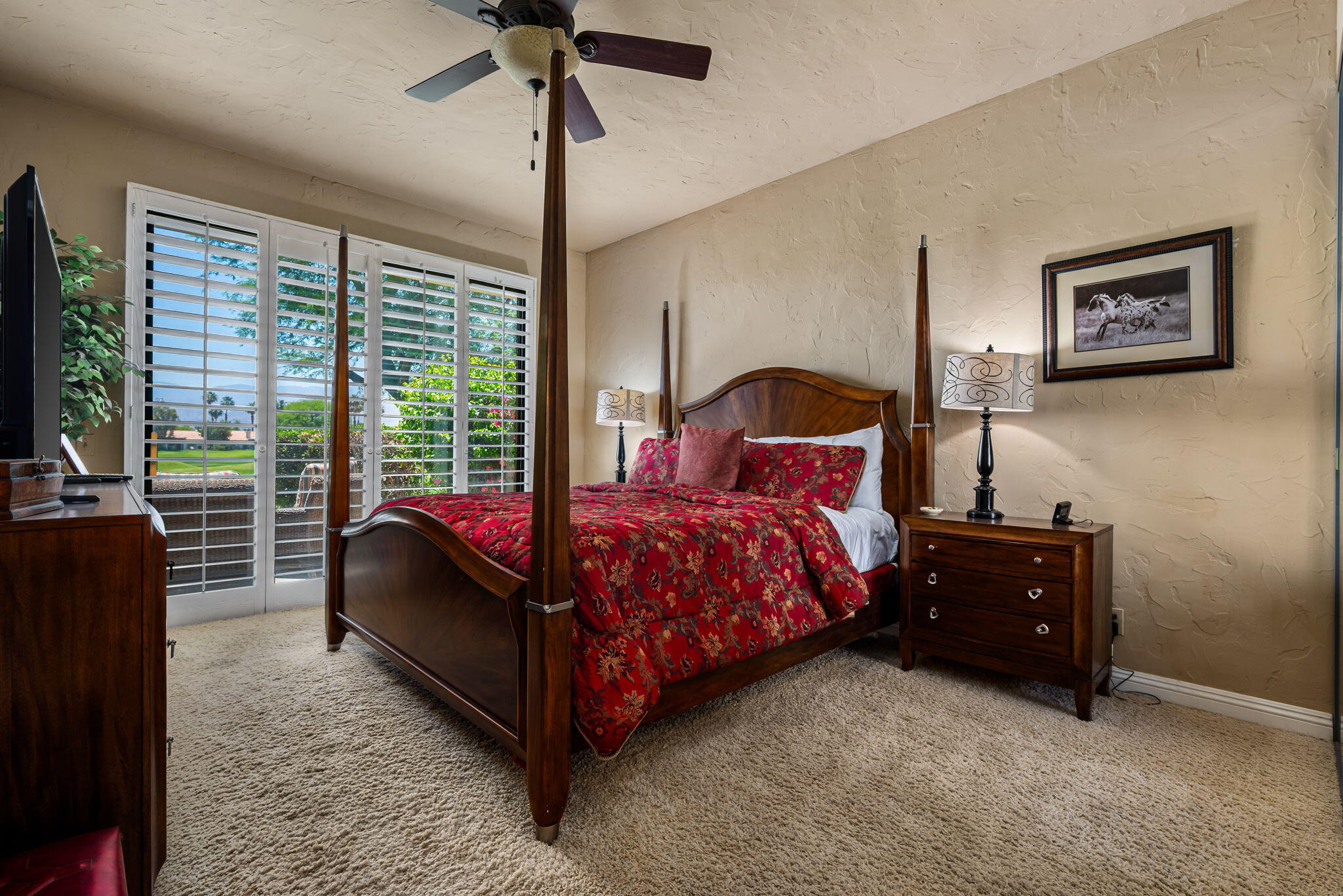 80601 Oak-Tree La Quinta, CA 92253 - Photo 28 of 64 a bedroom with a bed and a flat tv screen