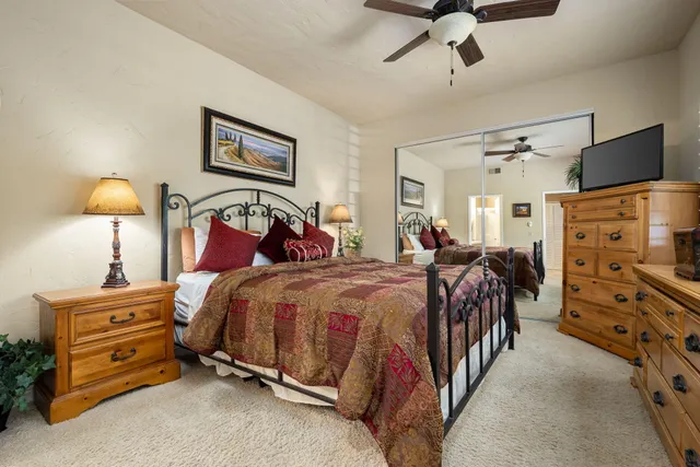 a view of a chairs and table in patio with a yard