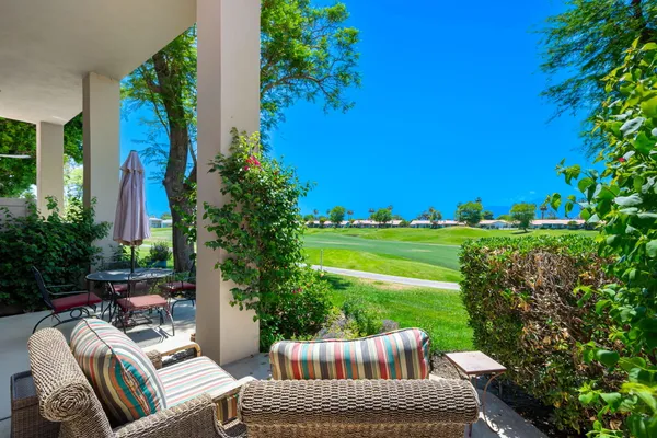 a view of a backyard of the house