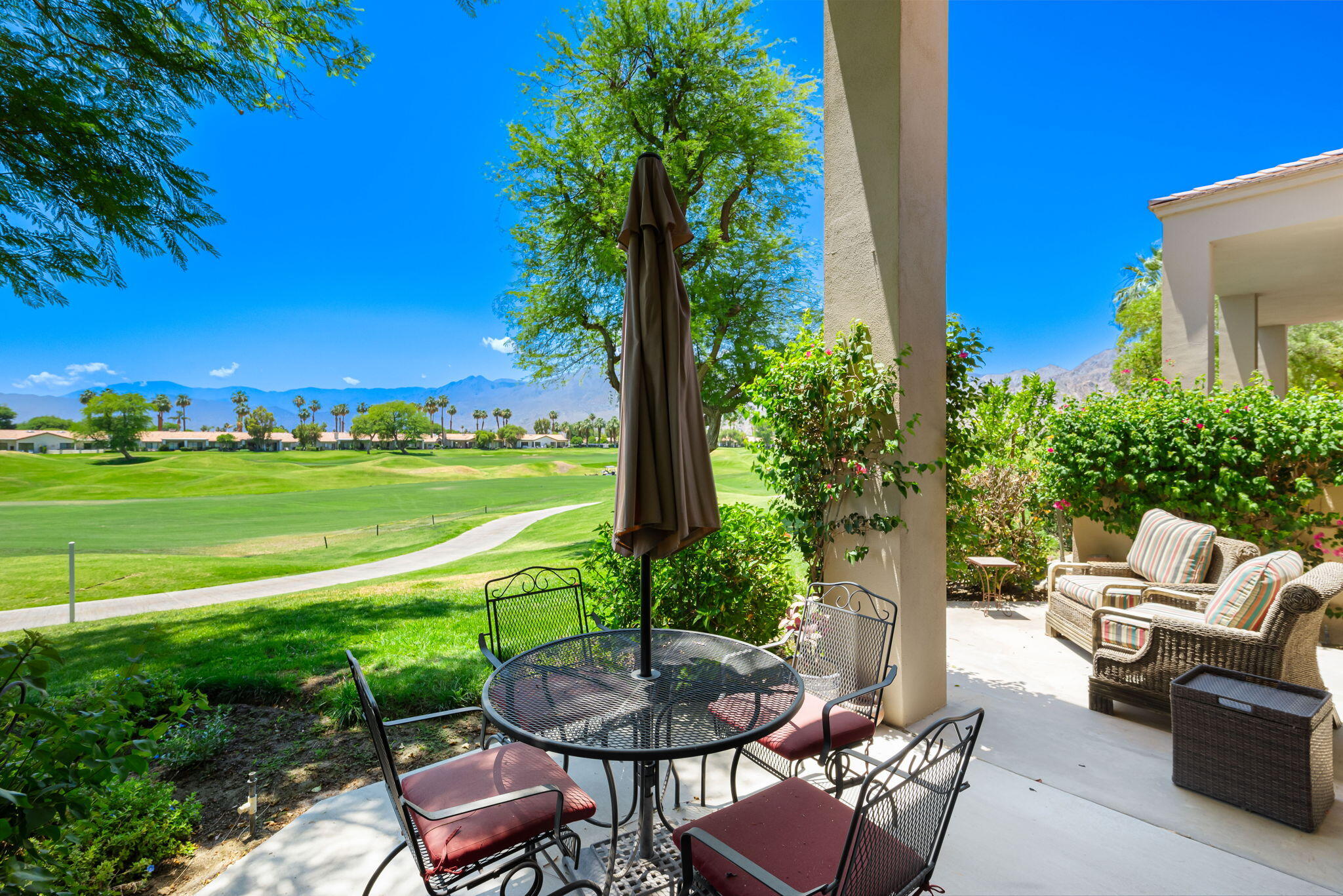 80601 Oak-Tree La Quinta, CA 92253 - Photo 38 of 64 a view of a chairs and table in patio with a yard