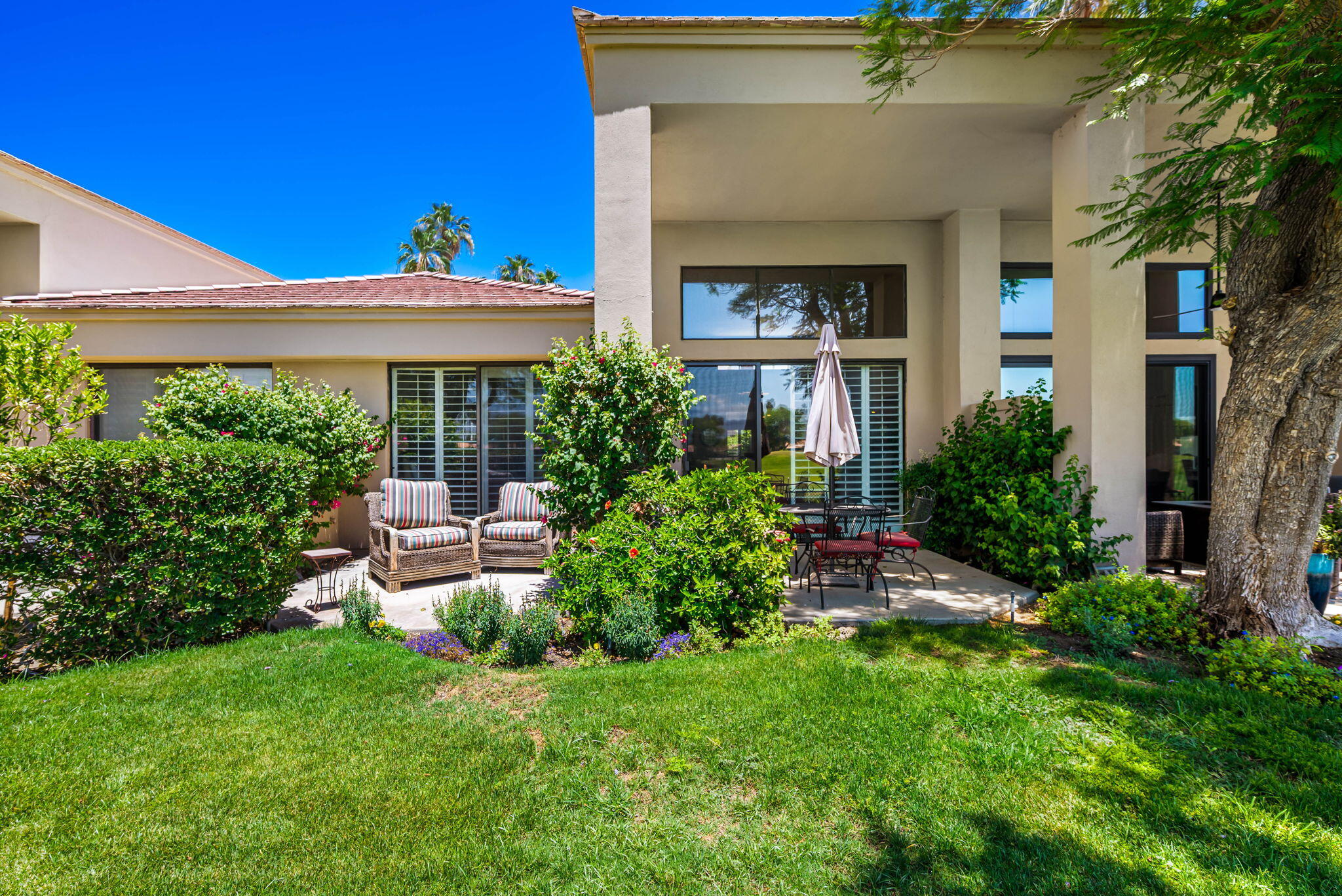 80601 Oak-Tree La Quinta, CA 92253 - Photo 40 of 64 a view of a chair and table in backyard of the house