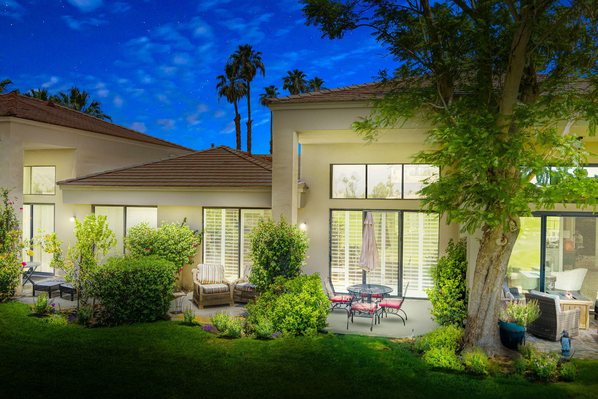 80601 Oak-Tree La Quinta, CA 92253 - Photo 4 of 64 a front view of a house with garden