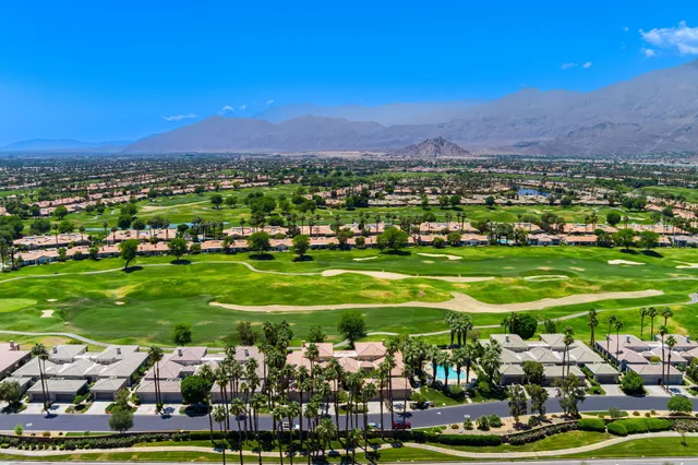 a view of a golf course with a house