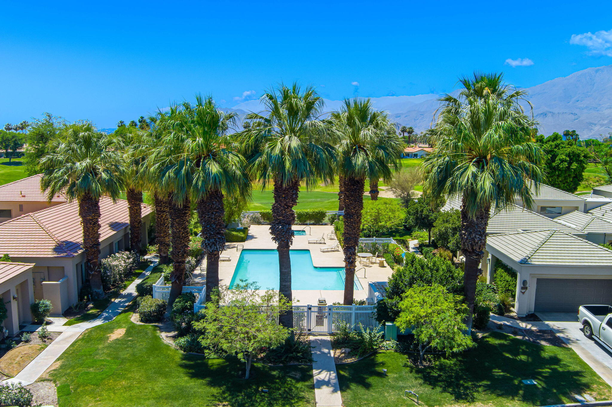 80601 Oak-Tree La Quinta, CA 92253 - Photo 48 of 64 a front view of a house with a yard