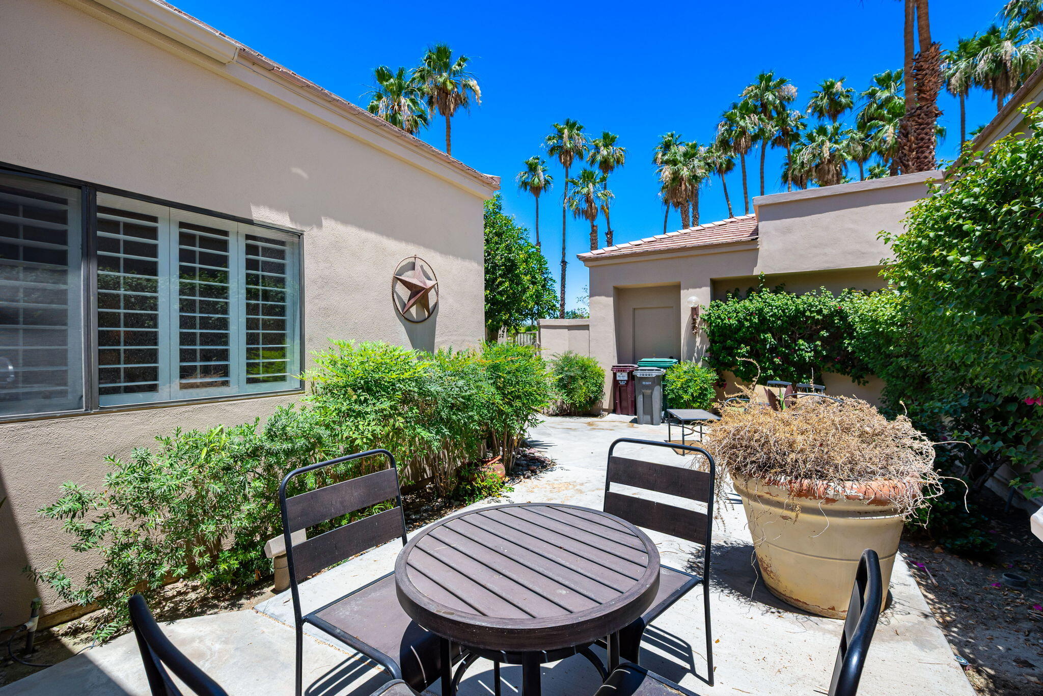 80601 Oak-Tree La Quinta, CA 92253 - Photo 8 of 64 a view of a chair and table in backyard of the house