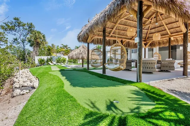 a bedroom with furniture and wooden floor