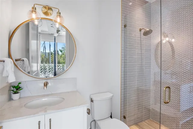 a view of a dining room with furniture and a window