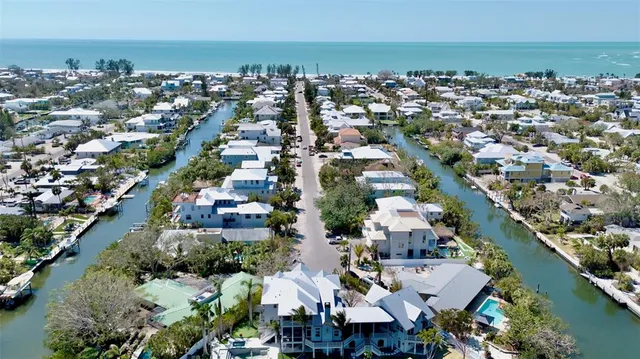 a dining room with furniture a rug and wooden floor
