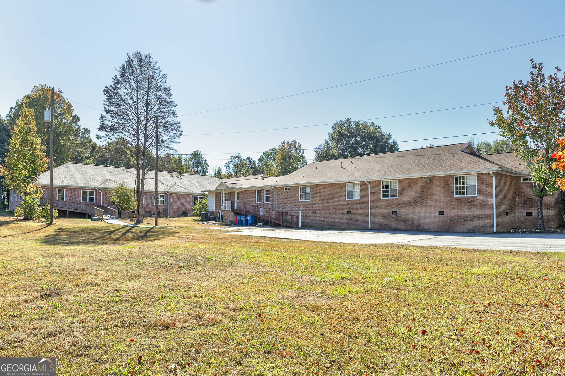 3084 Highway 81 Hampton, GA 30228 - Photo 12 of 57 a house view with a swimming pool next to a yard