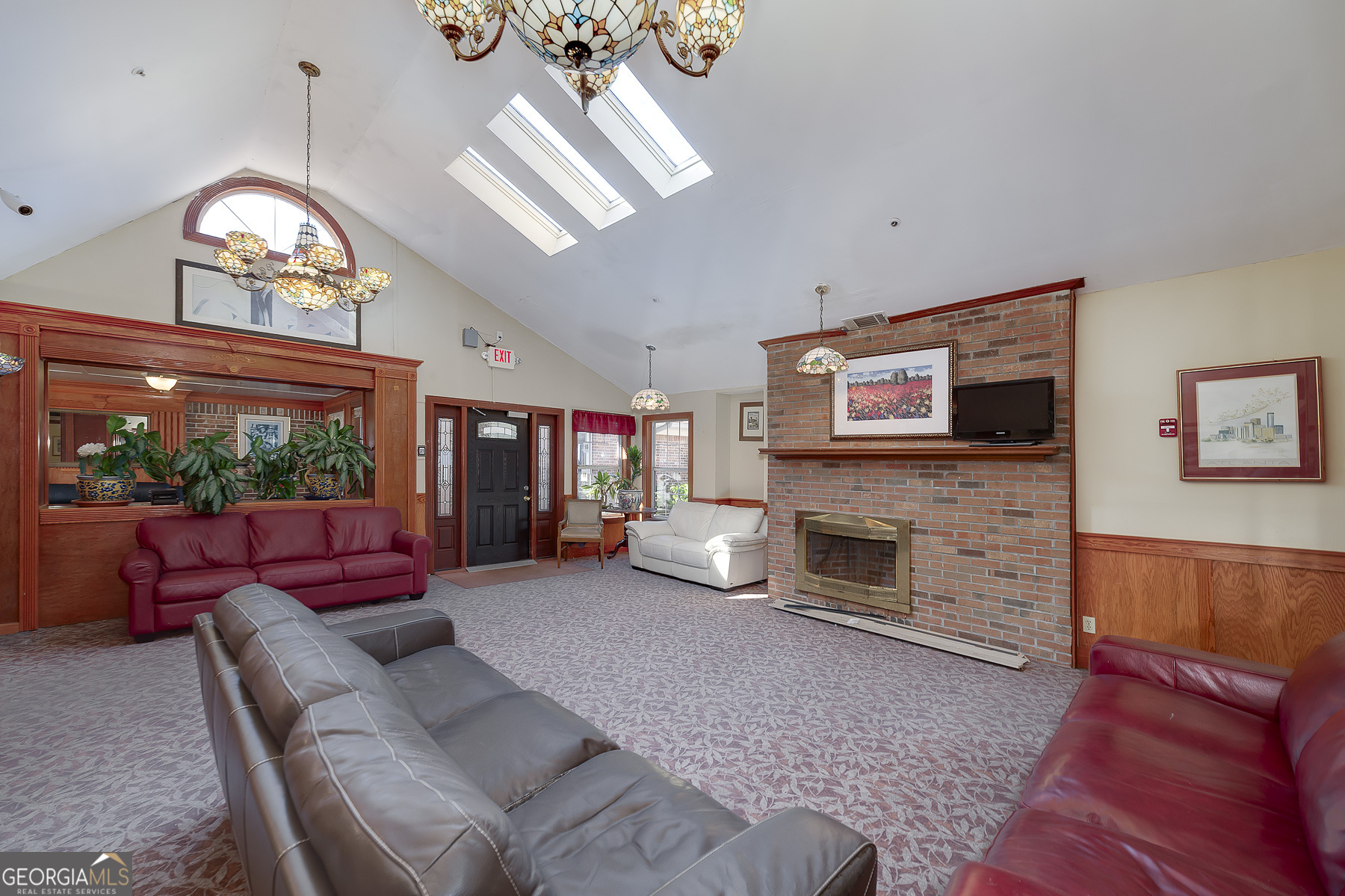 3084 Highway 81 Hampton, GA 30228 - Photo 21 of 57 a living room with furniture a fireplace and a flat screen tv