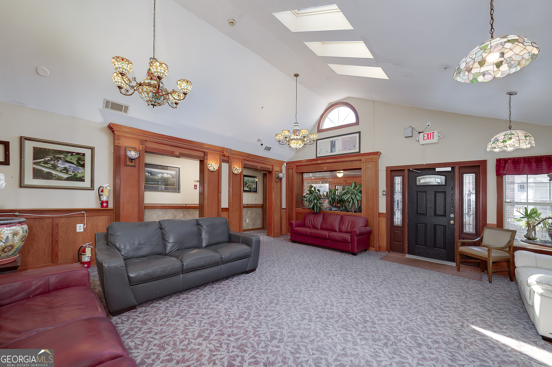 3084 Highway 81 Hampton, GA 30228 - Photo 22 of 57 a living room with furniture a fireplace and a chandelier