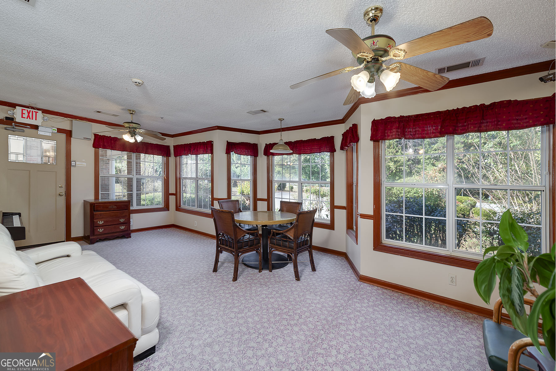 3084 Highway 81 Hampton, GA 30228 - Photo 25 of 57 a dining room with furniture a chandelier and large window