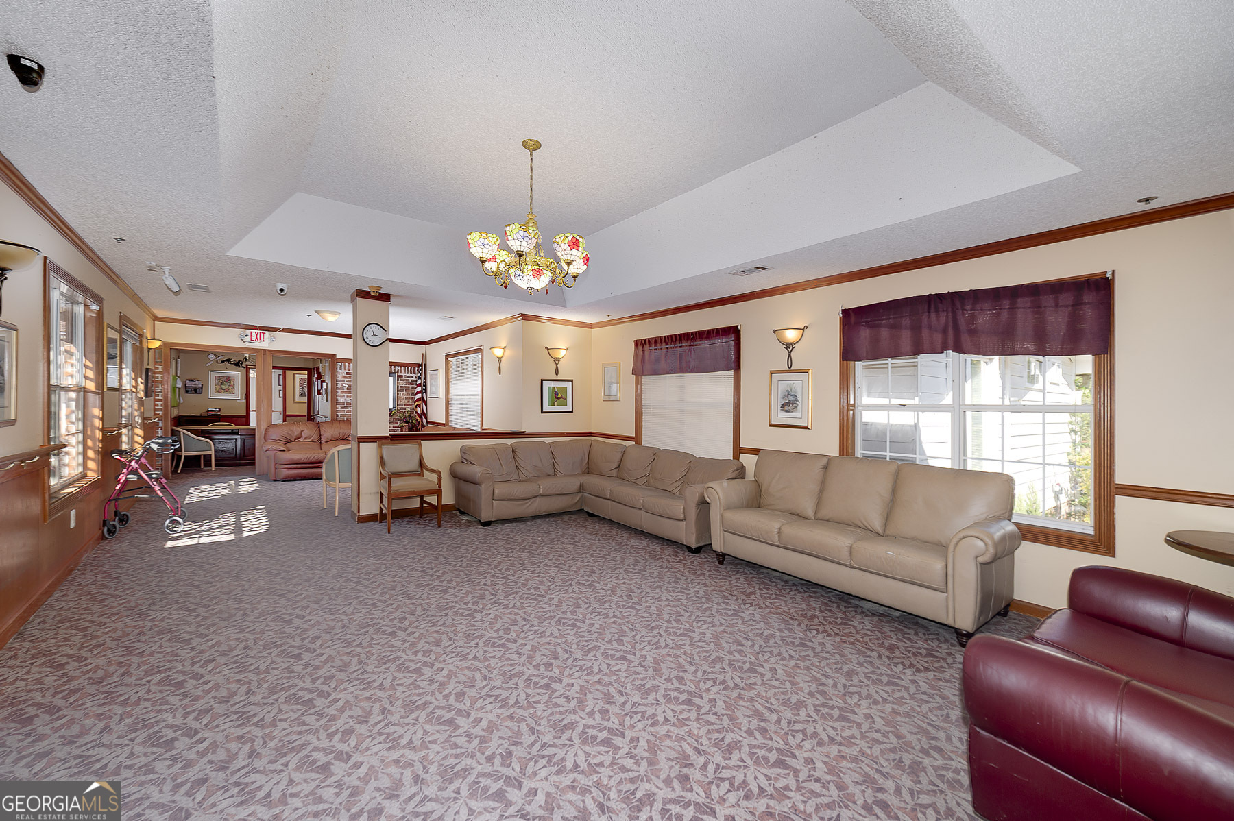 3084 Highway 81 Hampton, GA 30228 - Photo 31 of 57 a living room with furniture and a chandelier