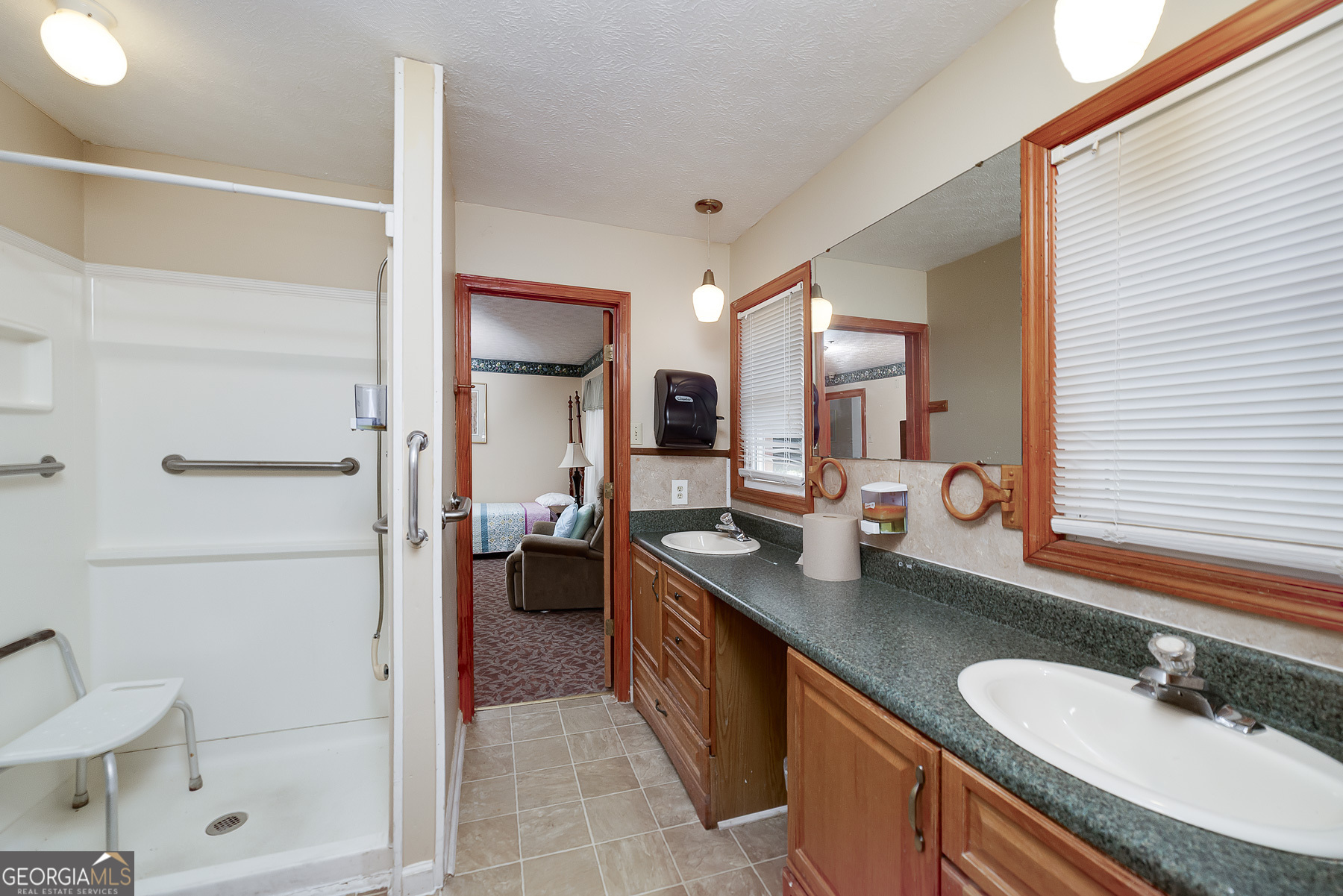 3084 Highway 81 Hampton, GA 30228 - Photo 42 of 57 a spacious bathroom with a granite countertop sink mirror and shower