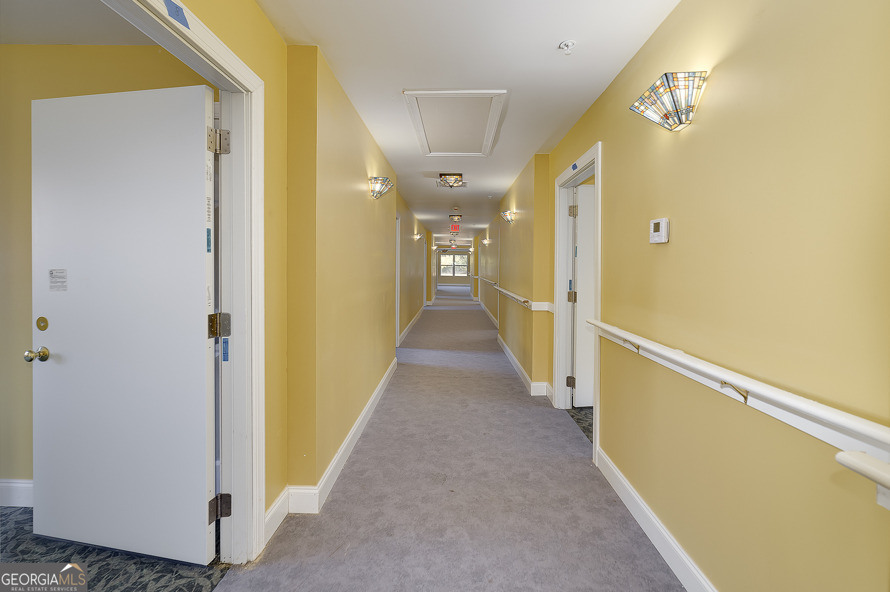 3084 Highway 81 Hampton, GA 30228 - Photo 45 of 57 a view of a hallway with wooden floor and staircase