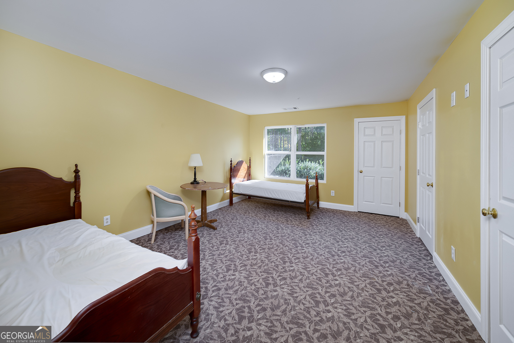 3084 Highway 81 Hampton, GA 30228 - Photo 46 of 57 a bedroom with a bed and a window