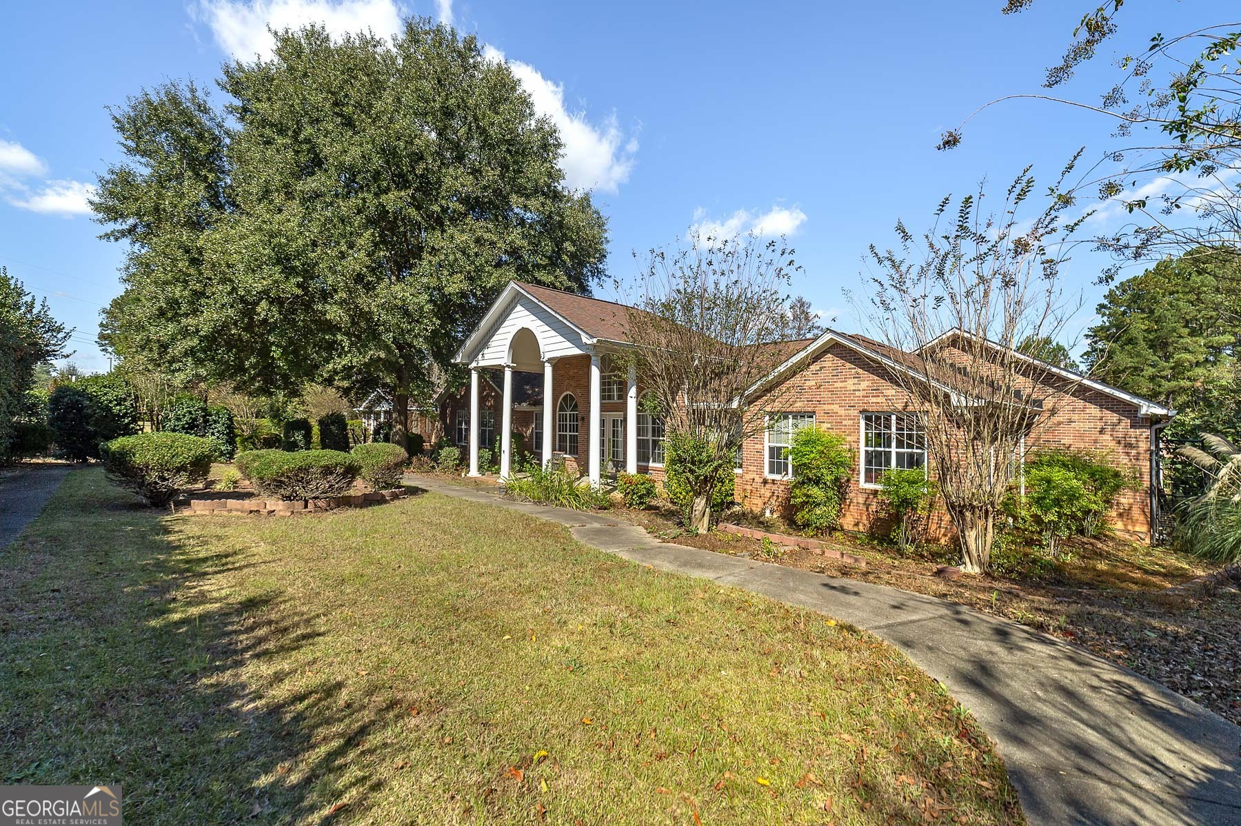 3084 Highway 81 Hampton, GA 30228 - Photo 5 of 57 a front view of a house with a yard
