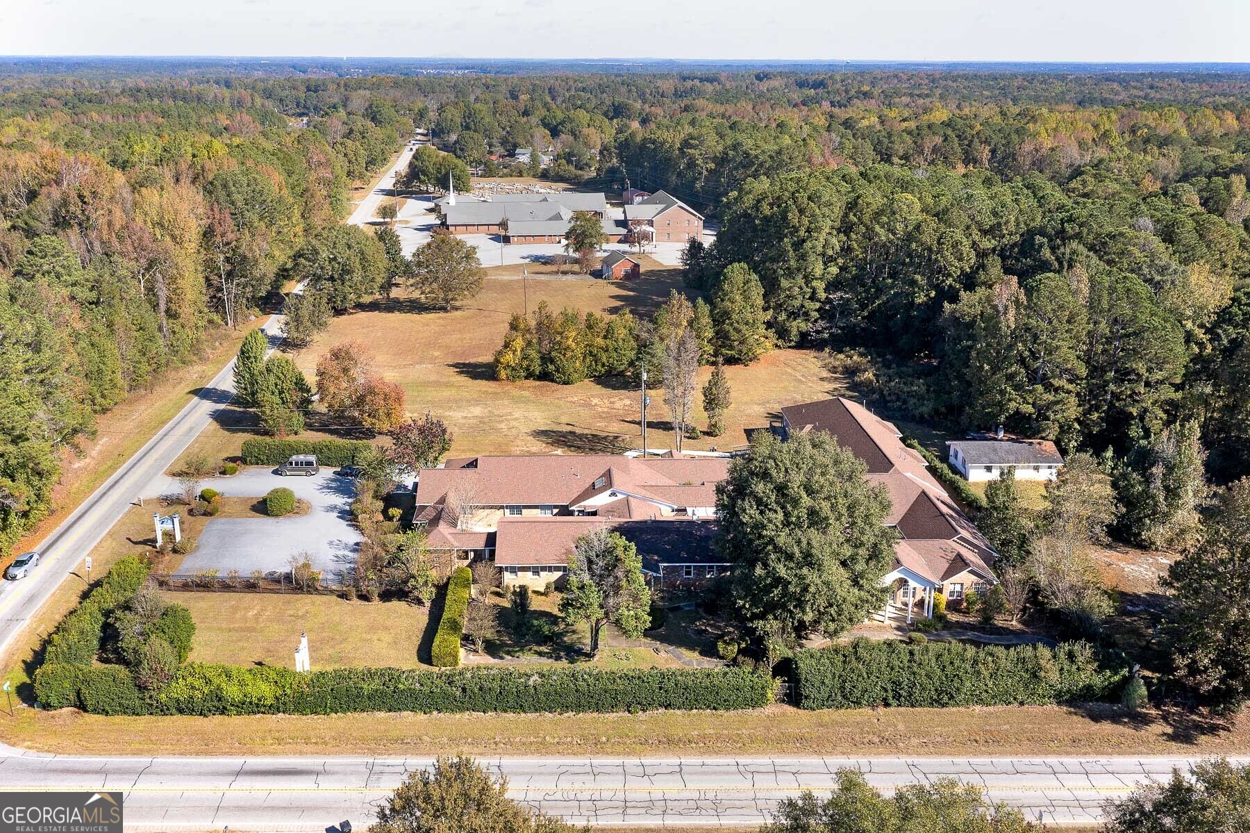 3084 Highway 81 Hampton, GA 30228 - Photo 51 of 57 an aerial view of a house with a yard and lake view