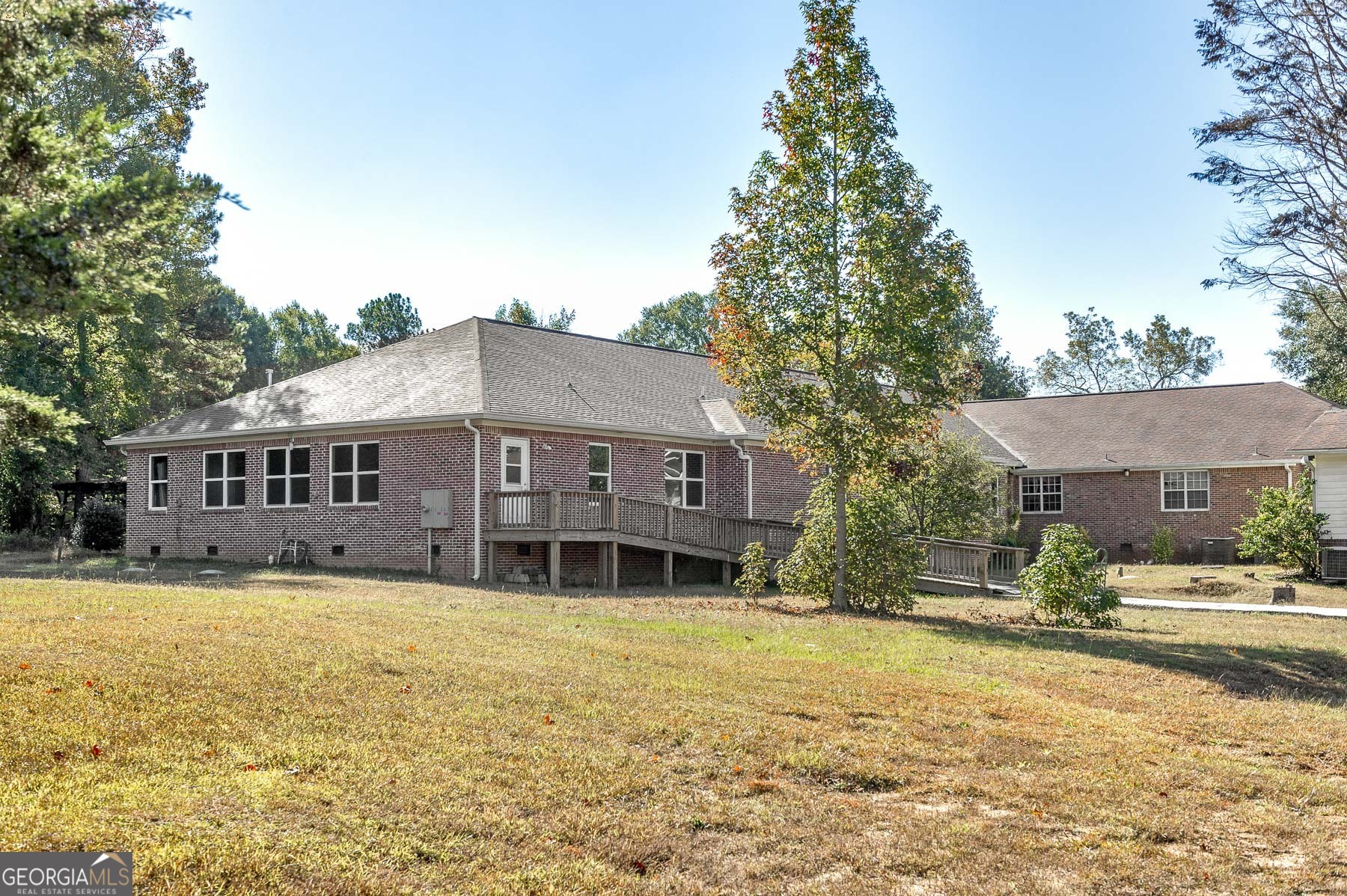 3084 Highway 81 Hampton, GA 30228 - Photo 7 of 57 a front view of a house with a yard
