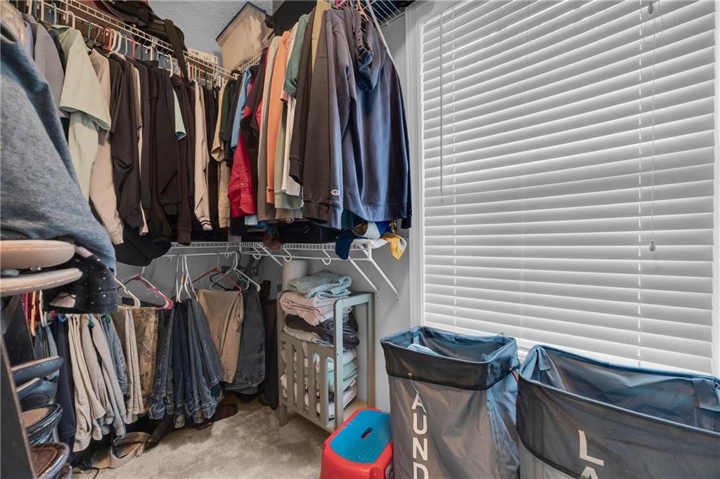 587-j B J B Owens Road Bethlehem, GA 30620 - Photo 45 of 99 a view of walk in closet with clothes and shoes